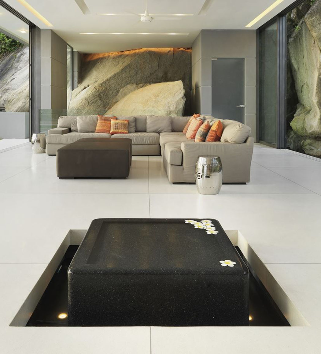 Canapé d’angle et un design intérieur épuré accentuant le côté luxueux et zen à la fois séjour canapé d'angle design élégant sobre
