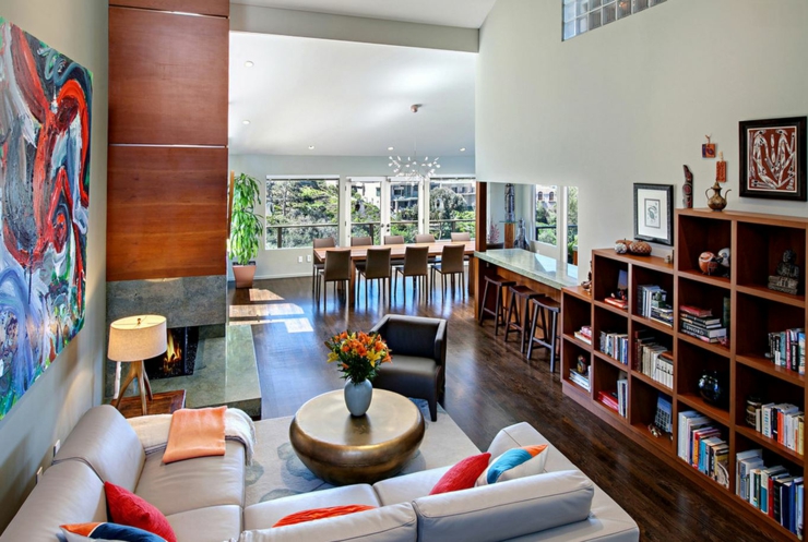 Coin cheminée, bibliothèque et relax de cette maison avec vue intérieur design luxe moderne