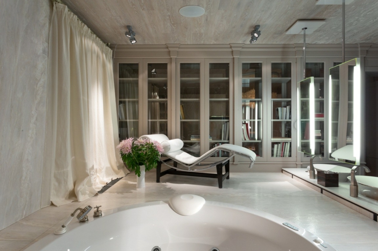 Salle de bains au jacuzzi design et fauteuil relax bibliothèque centre spa salle de bains design unique