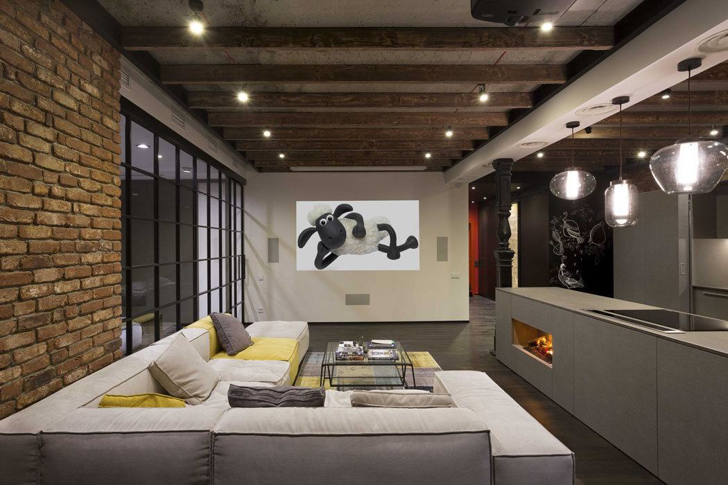 Luminaires au design épuré, ameublement minimaliste pour ce logement de ville assise de luxe canapé d'angle loft