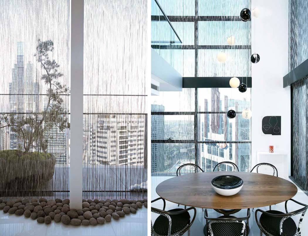 La hauteur dans la salle à manger correspond aux hauteurs des deux niveaux réunis design intérieur contemporaine luxe prestige appartement