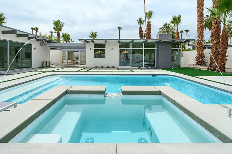 Grande piscine de luxe avec son jacuzzi intégré piscine construire jacuzzi