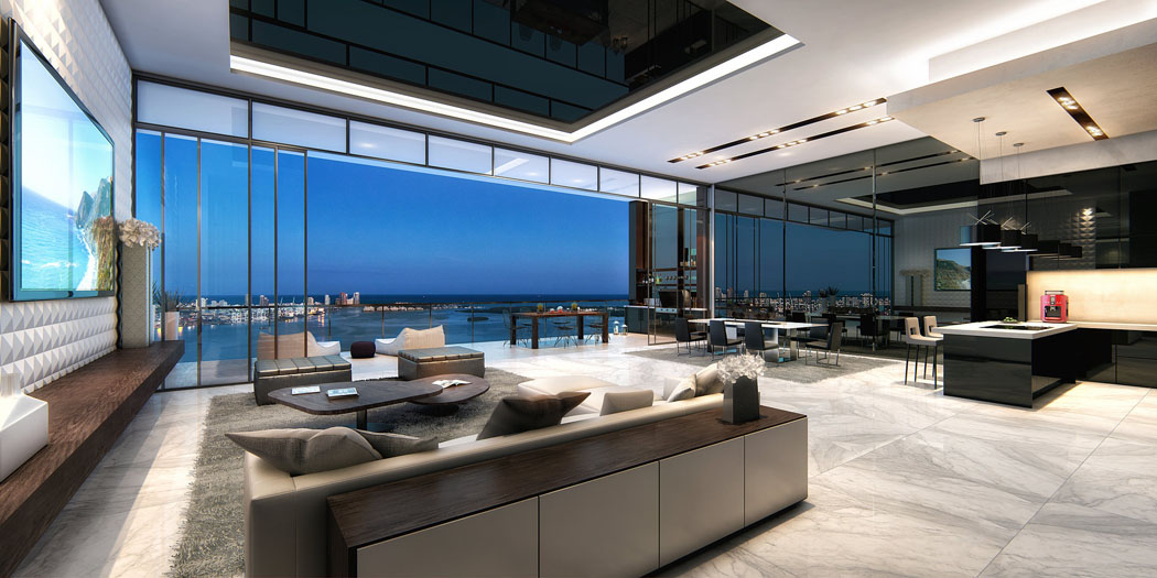 Une grande pièce de vie où se trouvent le salon, la salle à manger et la cuisine ouverte séjour design penthouse de luxe miami