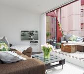 Séjour de cet appartement duplex situé à l’étage et donnant sur une belle terrasse appartement citadin design intérieur scandinave
