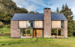 Une maison neuve reliant le style moderne et rustique à la fois extérieur maison neuve rustique moderne architecte