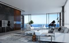 La pièce principale de vie de cet appartement de luxe avec le séjour & la salle à manger séjour design moderne avec vue sur la mer