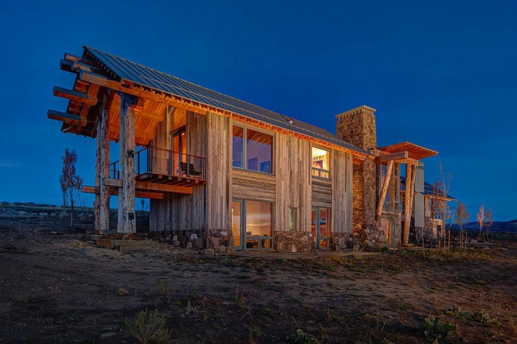 vue nocture chalet en bois brut maison d'architecte